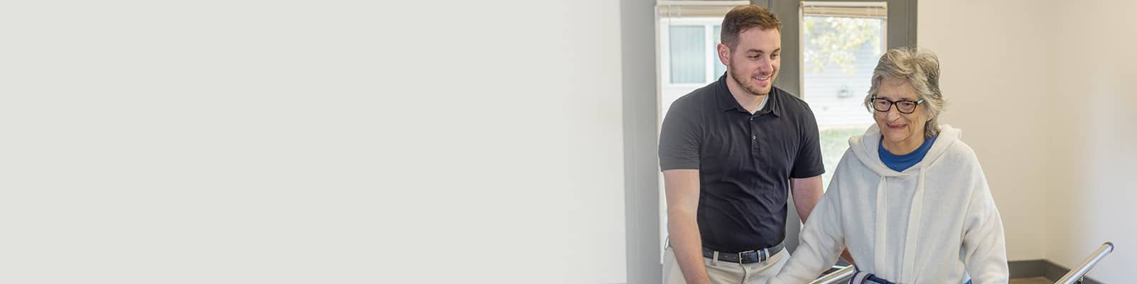 a rehab therapist and a resident at the Willow Knoll rehab gym